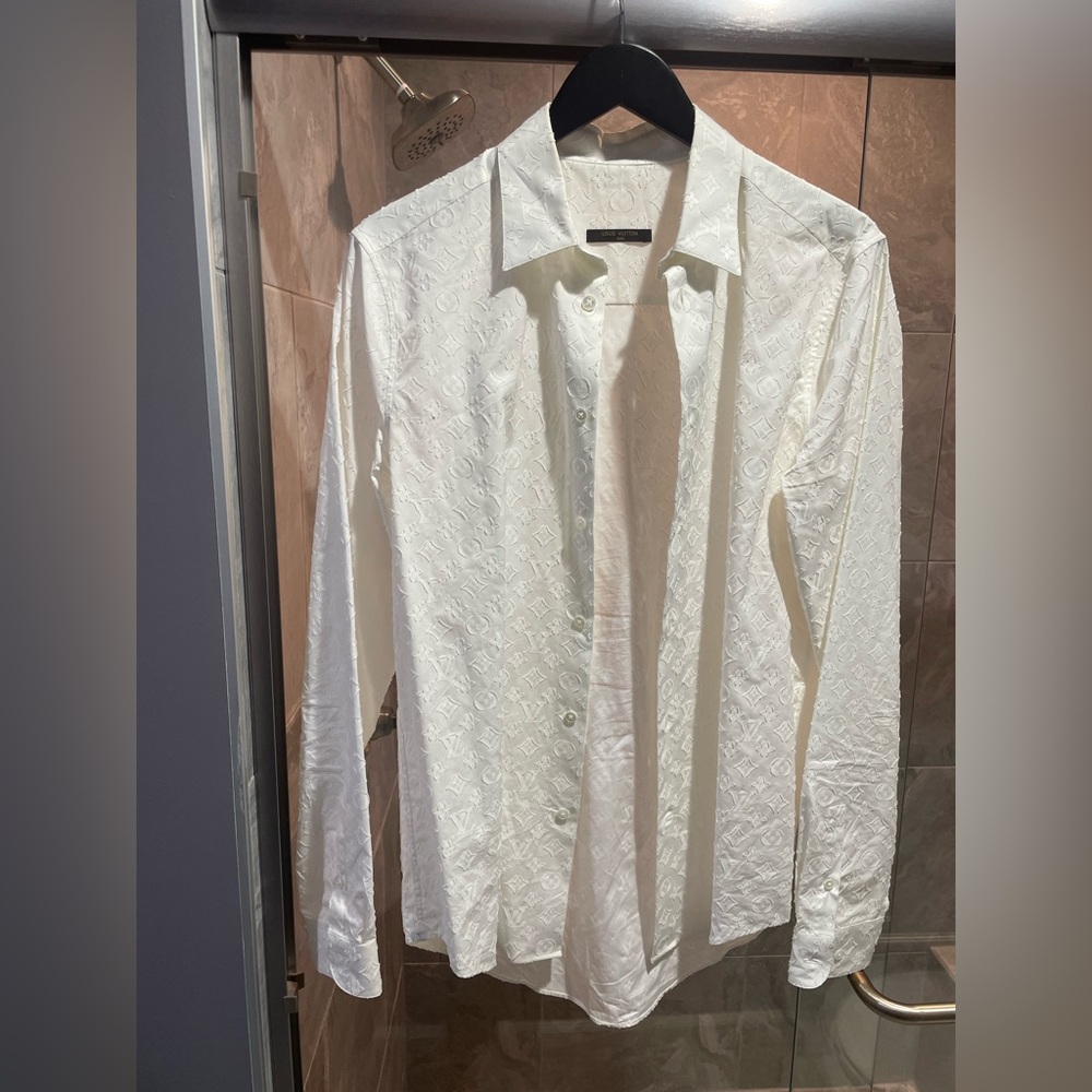 Rare white Louis Vuitton button up dress shirt with imprinted LV logos.